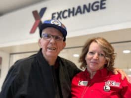 A veteran poses in the Exchange mall with an Exchange associate.